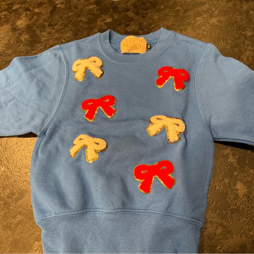 Blue Judith March Sweatshirt with Red and Cream bows